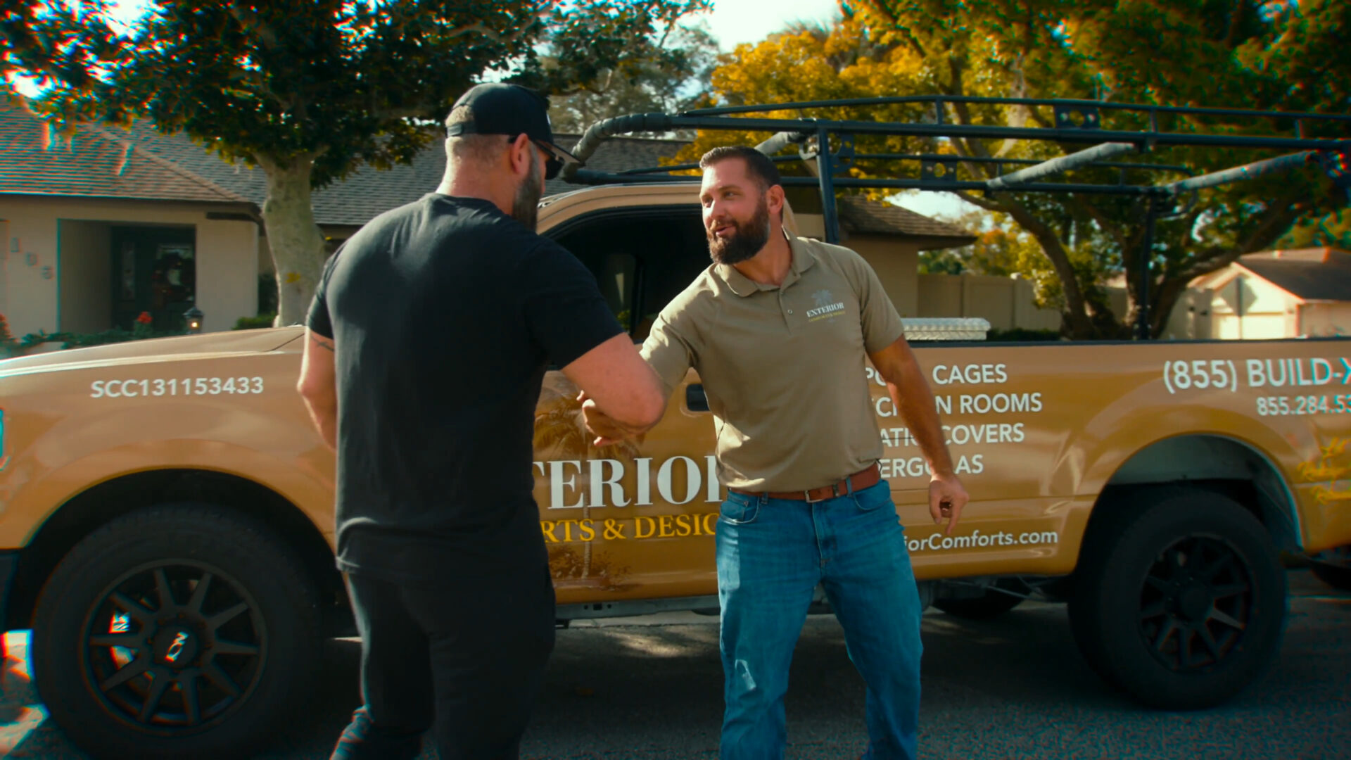 Owner Adam meeting with a customer about their screen enclosure