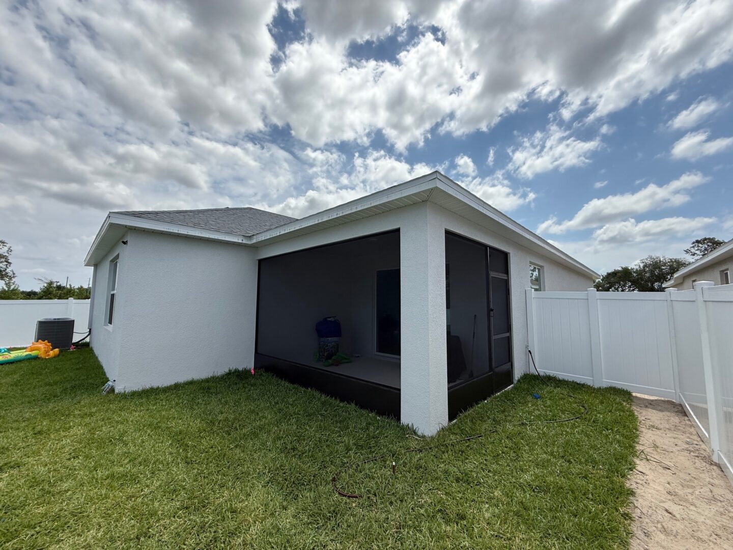 enclosed back porch with a screen to keep the bugs out